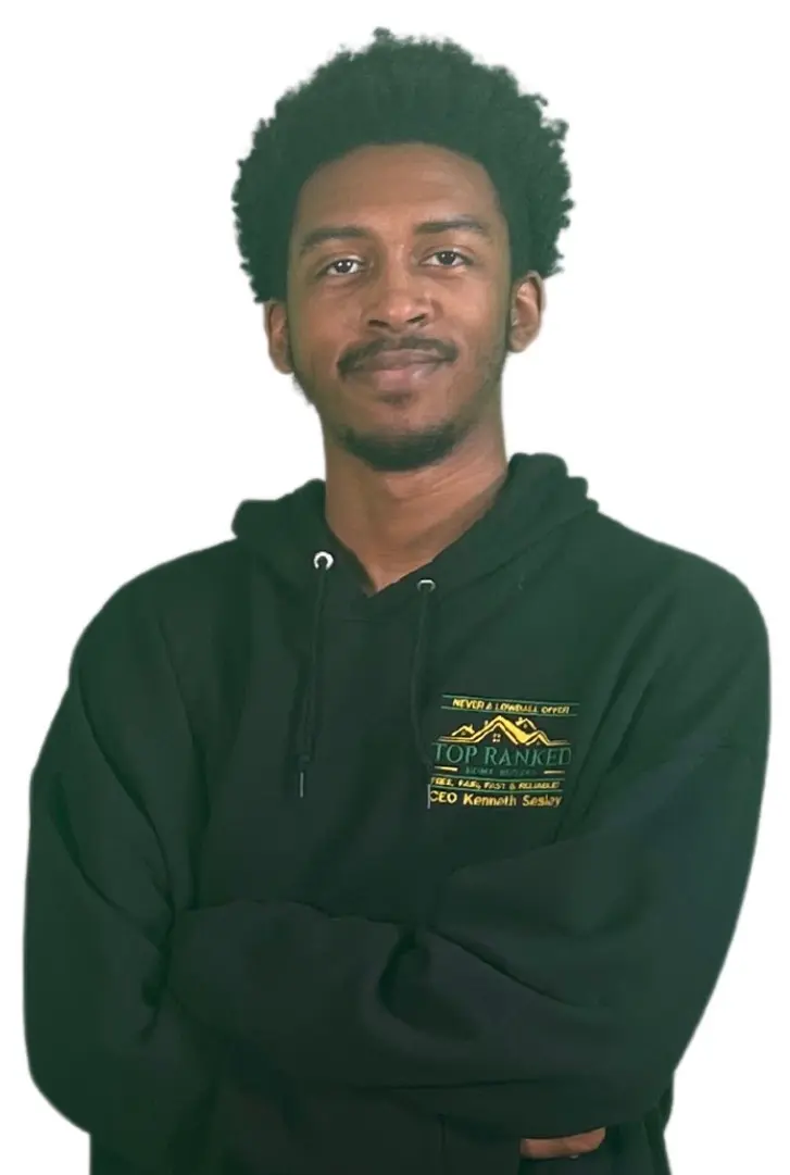 Kennedy Sesley, the Flip Dude (son) and Graphics and Marketing Manager, standing wearing a black company sweatshirt