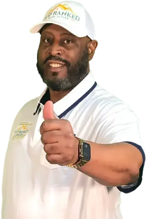 CEO Kenneth, The Flip Doctor, standing wearing a white polo and cap giving a thumbs up to everyone