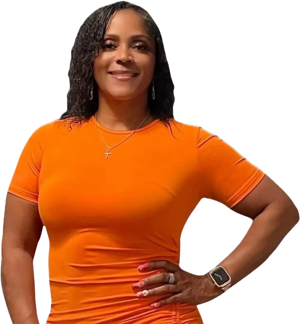 A picture of CFO Ms. Rose wearing a beautiful orange dress with her hand on her hip as "the Flipping Diva".